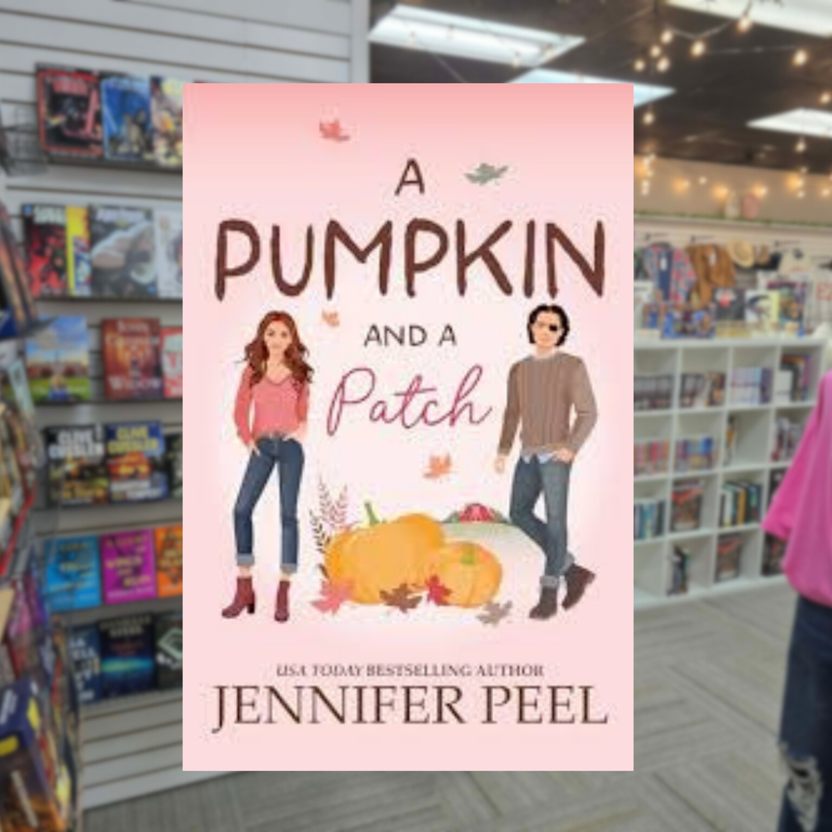 A Pumpkin and a Patch by Jennifer Peel fall romance book cover featuring an illustrated woman in a pink sweater and a man in a brown sweater standing beside pumpkins against a soft pink autumn background.