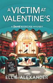 A Victim at Valentine's by Ellie Alexander cozy mystery book cover featuring a charming bookstore with tall bookshelves, pink heart-shaped decorations, cozy reading chairs, and a Valentine's Day display.