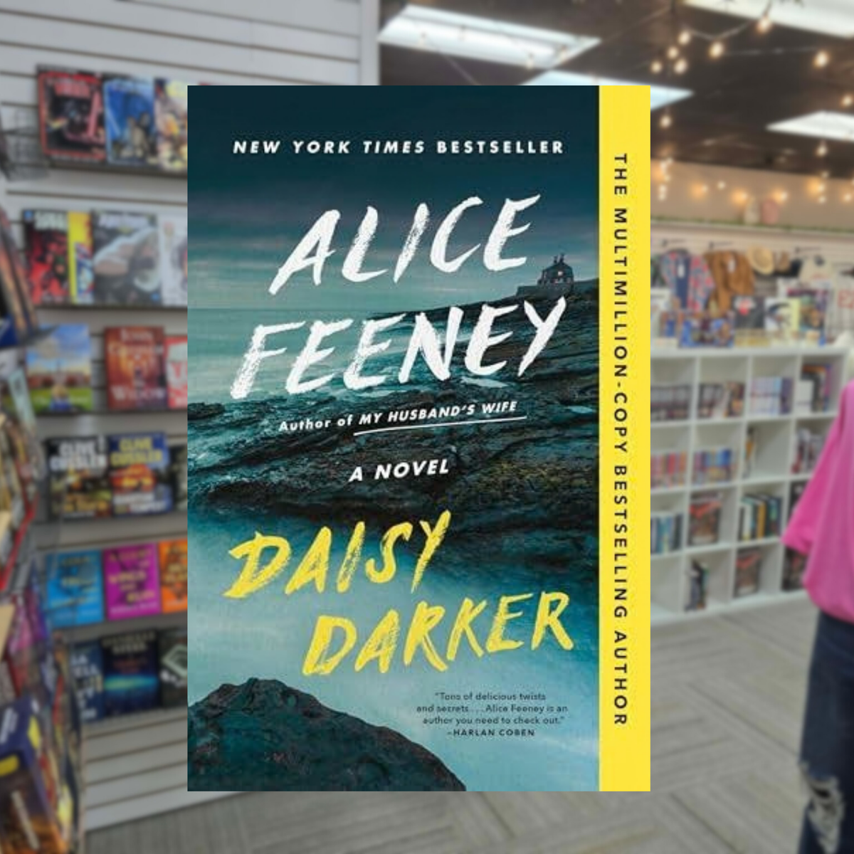 Daisy Darker by Alice Feeney psychological thriller paperback book cover featuring a dark rocky coastline, stormy ocean, distant lighthouse, and bold yellow title lettering
