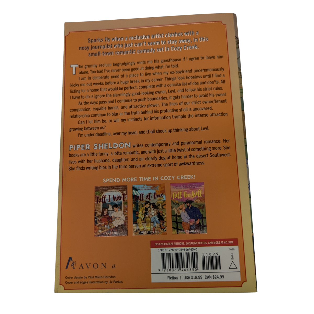 Fall Shook Up by Piper Sheldon cozy autumn romance book cover featuring an illustrated couple in a small-town shop with a gray cat