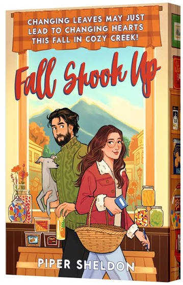Fall Shook Up by Piper Sheldon cozy autumn romance book cover featuring an illustrated couple in a small-town shop with a gray cat