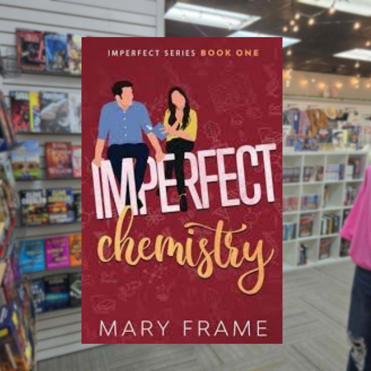Imperfect Chemistry by Mary Frame romantic comedy paperback cover featuring an illustrated man in a blue shirt and woman in a yellow top sitting together against a burgundy background.