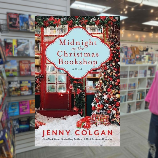 Midnight at the Christmas Bookshop by Jenny Colgan paperback cover featuring a festive red bookstore decorated with Christmas garlands, a colorful Christmas tree, wrapped presents, and snow