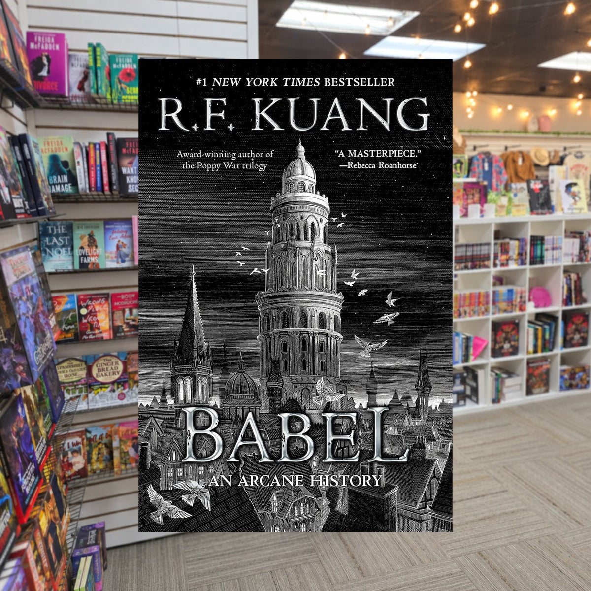 Babel by R.F. Kuang — actual cover on The Perk bookstore background