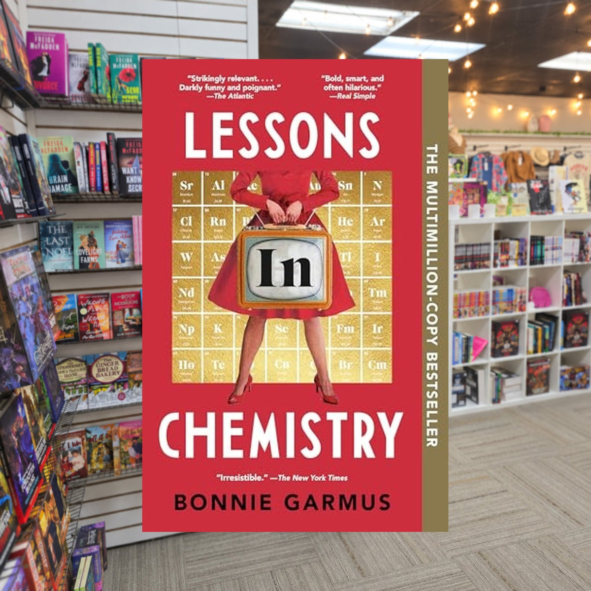 Lessons in Chemistry by Bonnie Garmus — actual cover on The Perk bookstore background