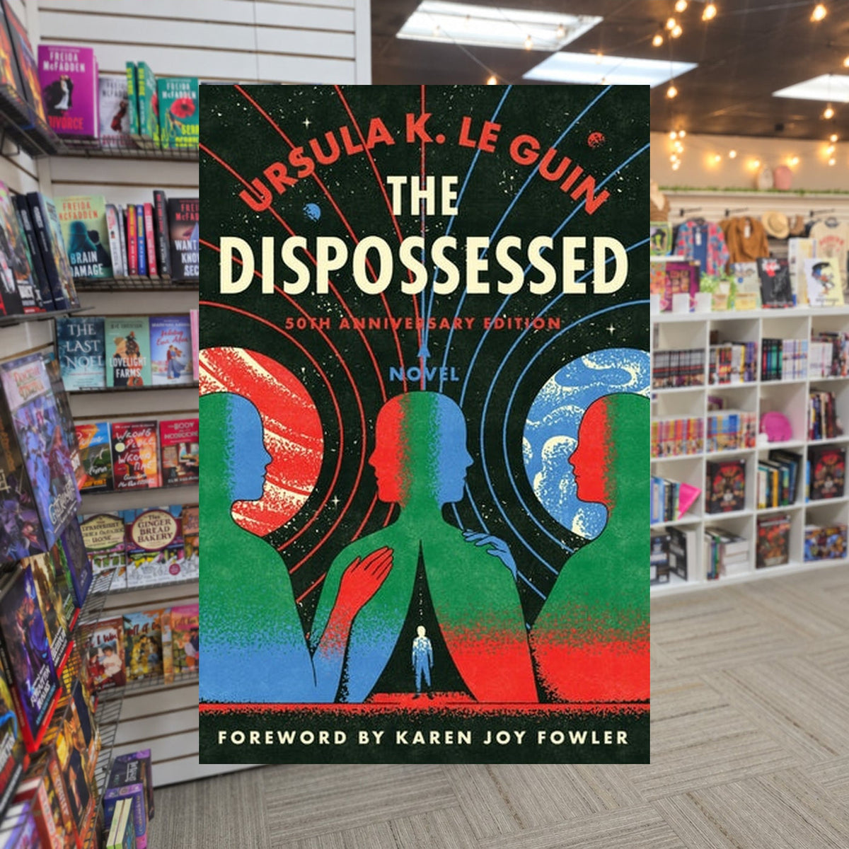The Dispossessed by Ursula K. Le Guin — actual cover on The Perk bookstore background