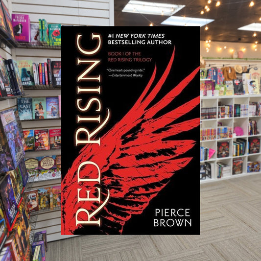 Red Rising by Pierce Brown — actual cover on The Perk bookstore background