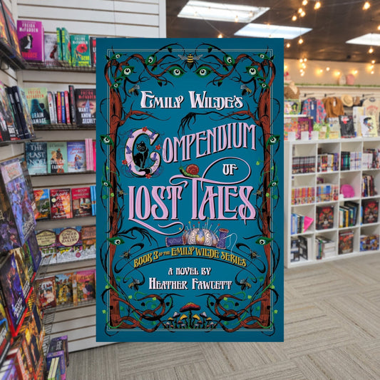 Emily Wilde's Compendium of Lost Tales by Heather Fawcett — actual cover on The Perk bookstore background