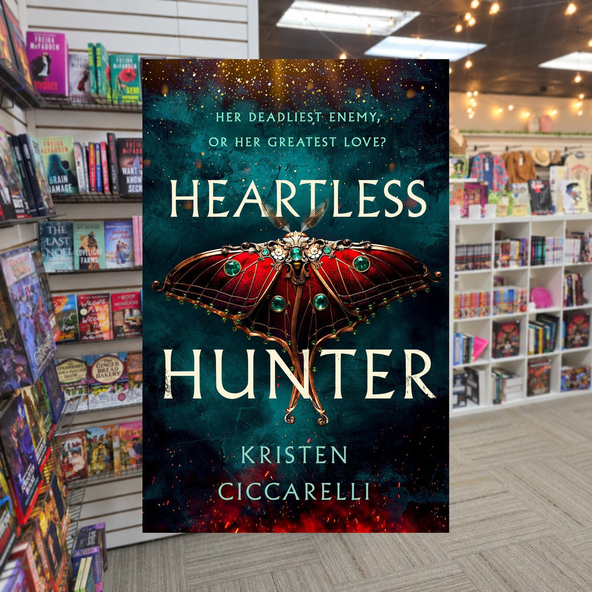 The Crimson Moth #1: Heartless Hunter by Kristen Ciccarelli — actual cover on The Perk bookstore background