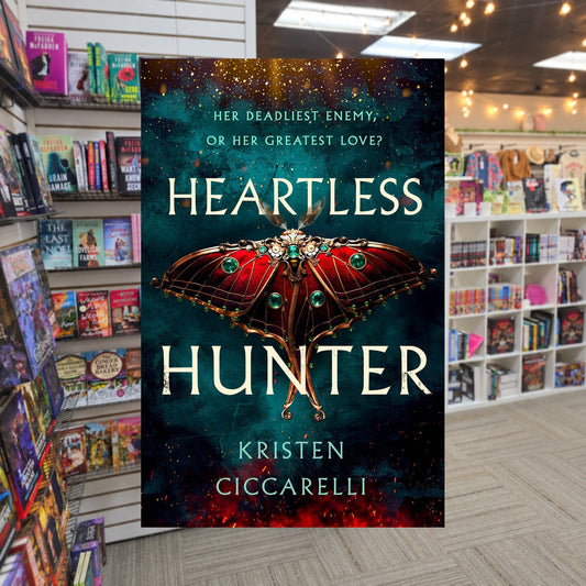 The Crimson Moth #1: Heartless Hunter by Kristen Ciccarelli — actual cover on The Perk bookstore background