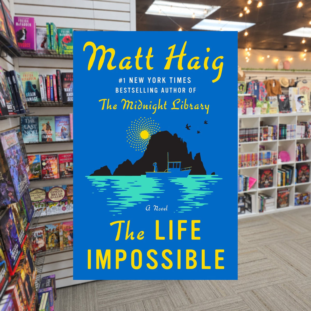 The Life Impossible by Matt Haig — actual cover on The Perk bookstore background