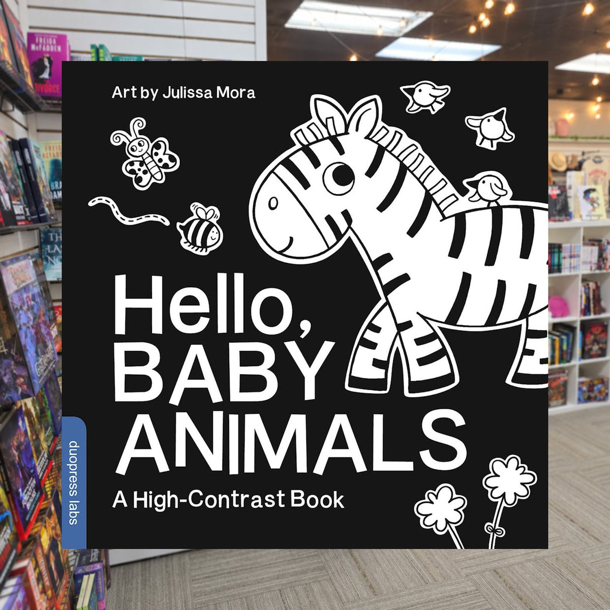 Hello, Baby Animals by duopress labs , Julissa Mora — actual cover on The Perk bookstore background