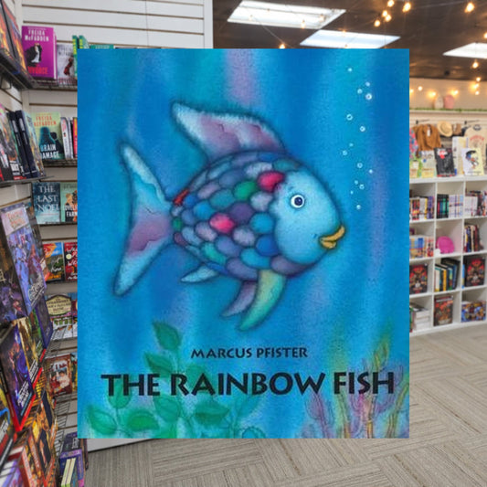 The Rainbow Fish by Marcus Pfister — actual cover on The Perk bookstore background
