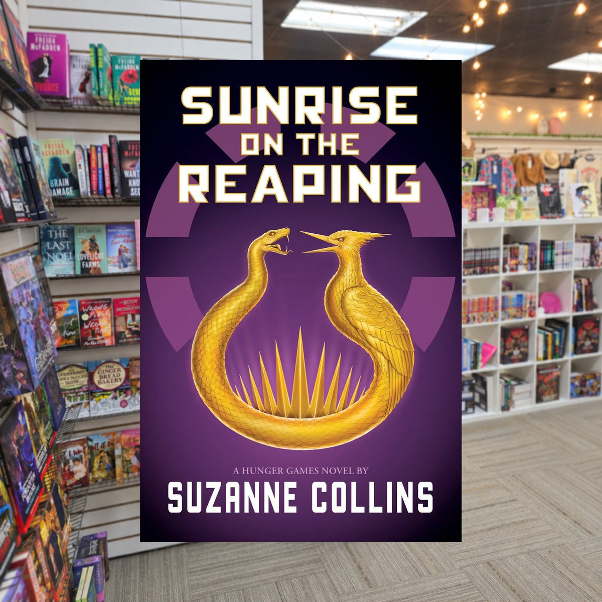 The Hunger Games: Sunrise on the Reaping by Suzanne Collins — actual cover on The Perk bookstore background