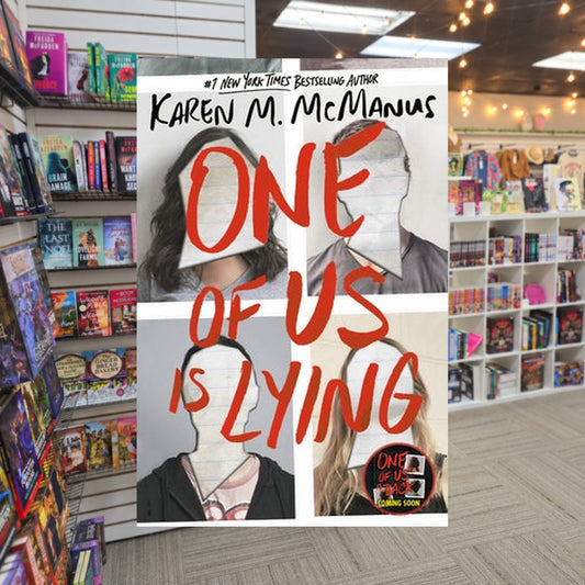 One of Us Is Lying #1: One of Us Is Lying by Karen M. McManus — actual cover on The Perk bookstore background