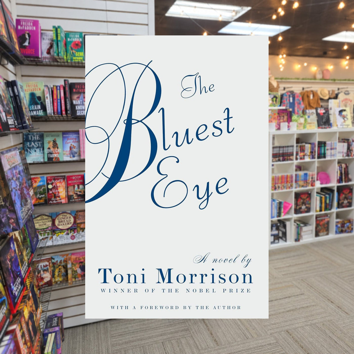 The Bluest Eye — actual cover on The Perk bookstore background
