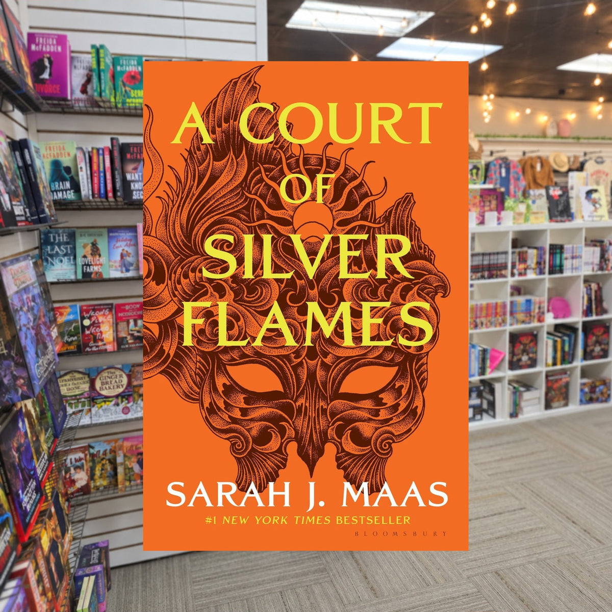 A Court of Silver Flames — actual cover on The Perk bookstore background