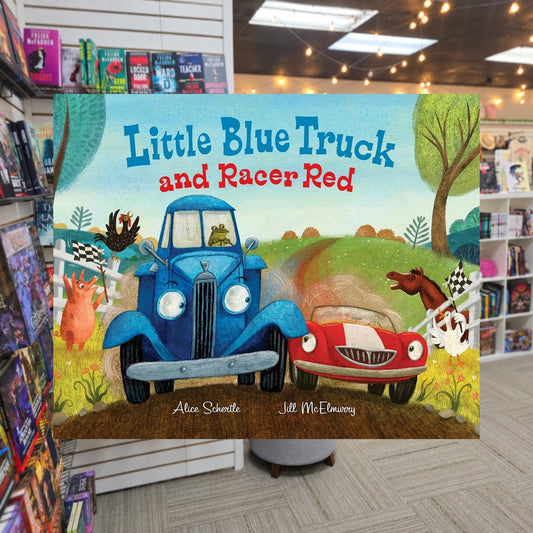 Little Blue Truck and Racer Red by Alice Schertle ,  Jill McElmurry — actual cover on The Perk bookstore background