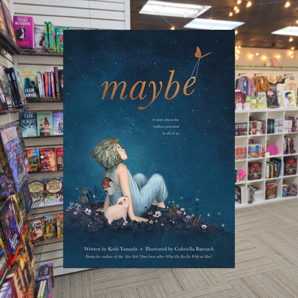 Maybe: A Story About the Endless Potential in All of Us by Kobi Yamada, Gabriella Barouch (Illustrator) — actual cover on The Perk bookstore background