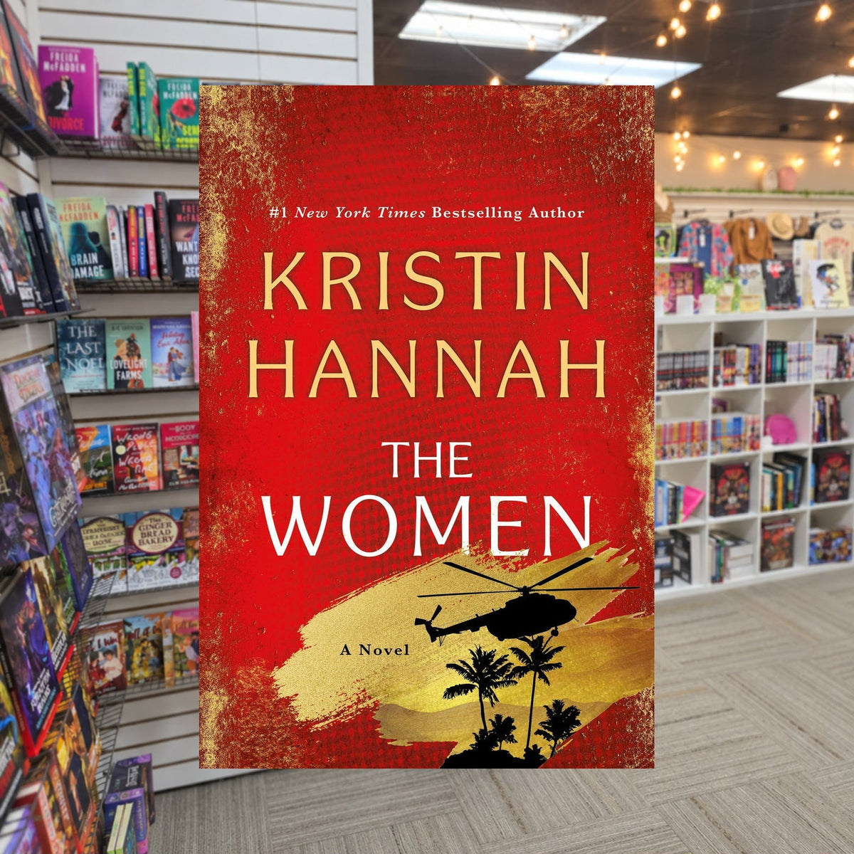 The Women by Kristen Hannah — actual cover on The Perk bookstore background