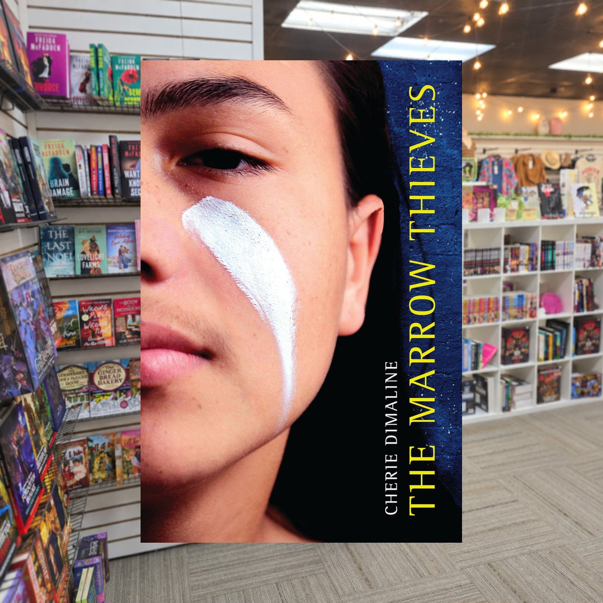 The Marrow Thieves #1: The Marrow Thieves by Cherie Dimaline — actual cover on The Perk bookstore background