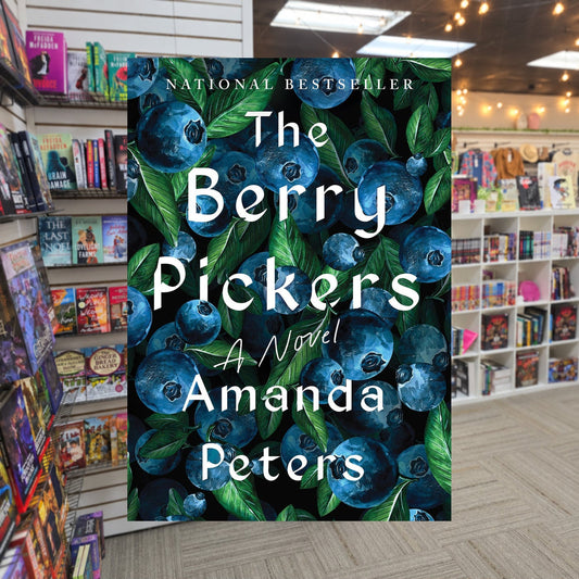 The Berry Pickers by Amanda Peters — actual cover on The Perk bookstore background