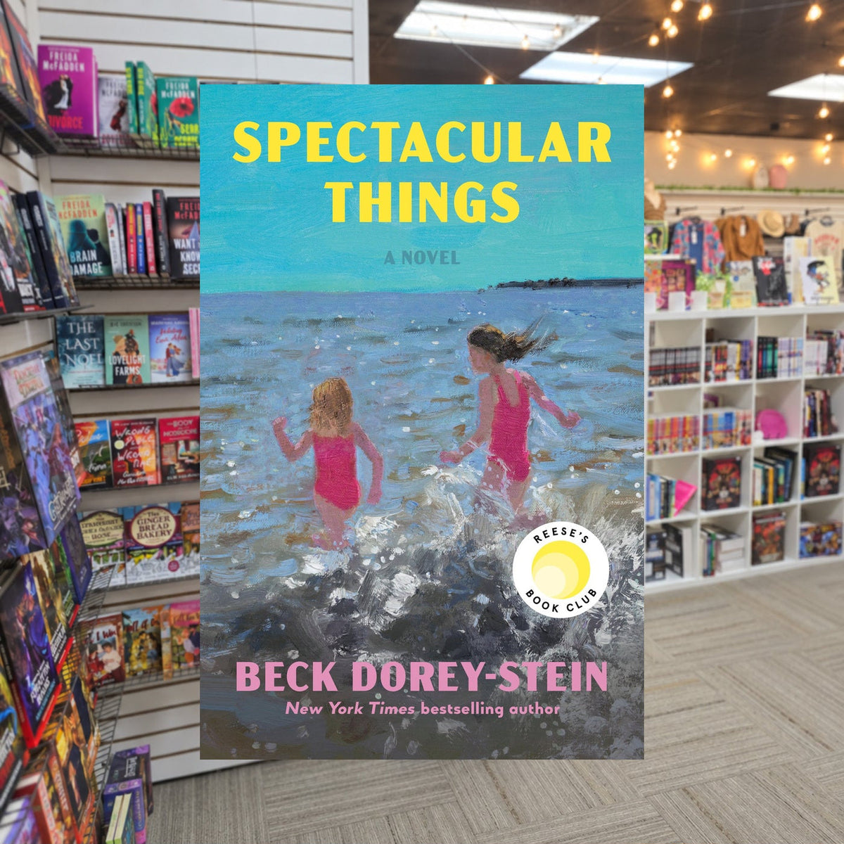 Spectacular Things by Beck Dorey-Stein — actual cover on The Perk bookstore background