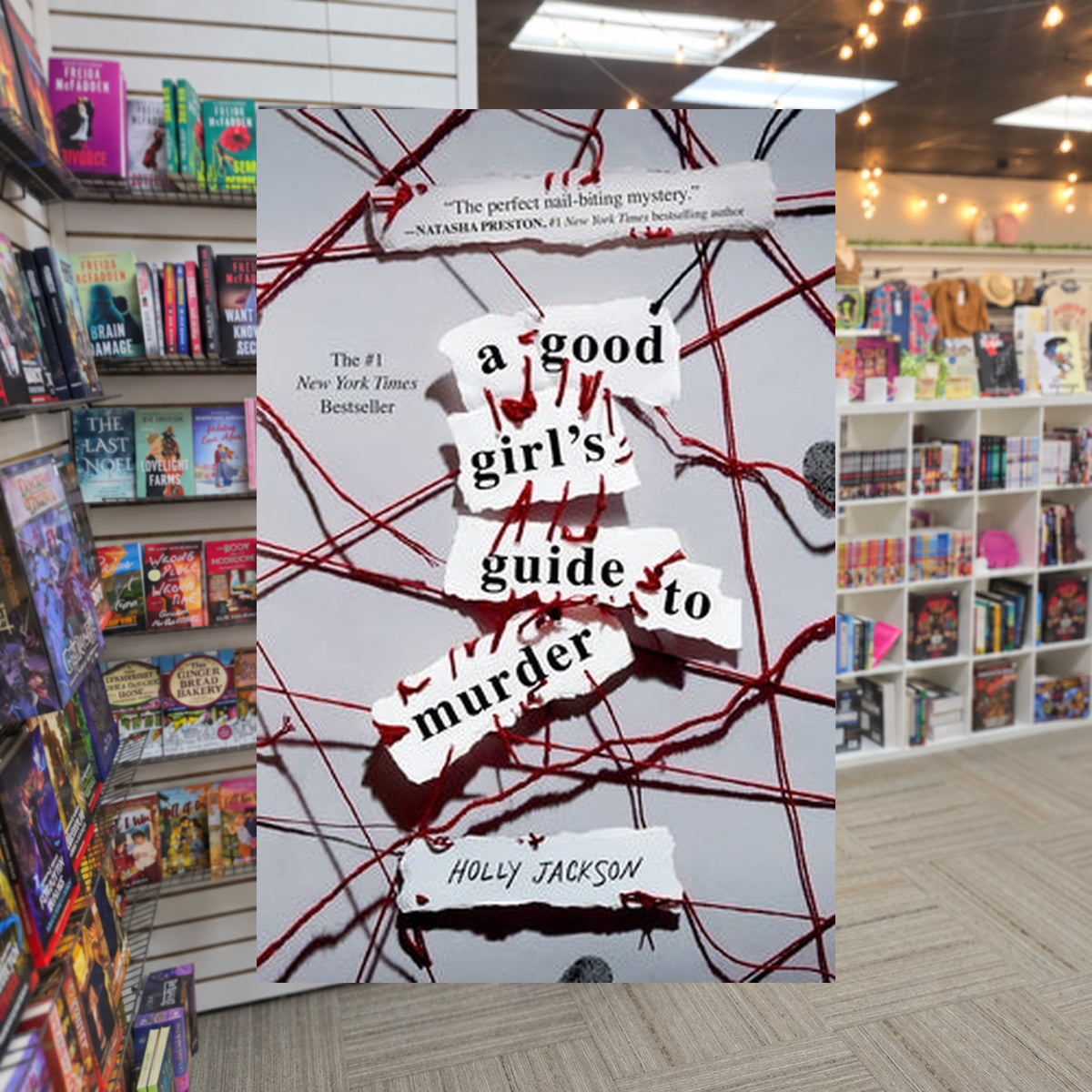 A Good Girl's Guide to Murder #1: A Good Girl's Guide to Murder by Holly Jackson — actual cover on The Perk bookstore background