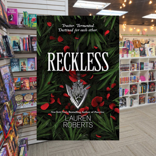 The Powerless Trilogy #2: Reckless by Lauren Roberts — actual cover on The Perk bookstore background