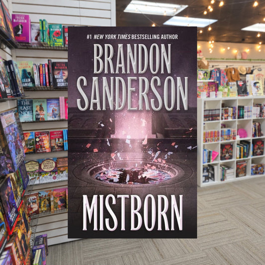 Mistborn by Brandon Sanderson — actual cover on The Perk bookstore background