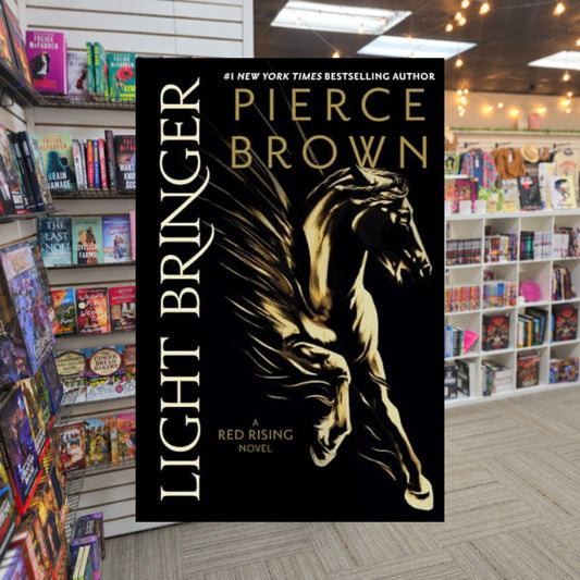 Light Bringer by Pierce Brown — actual cover on The Perk bookstore background