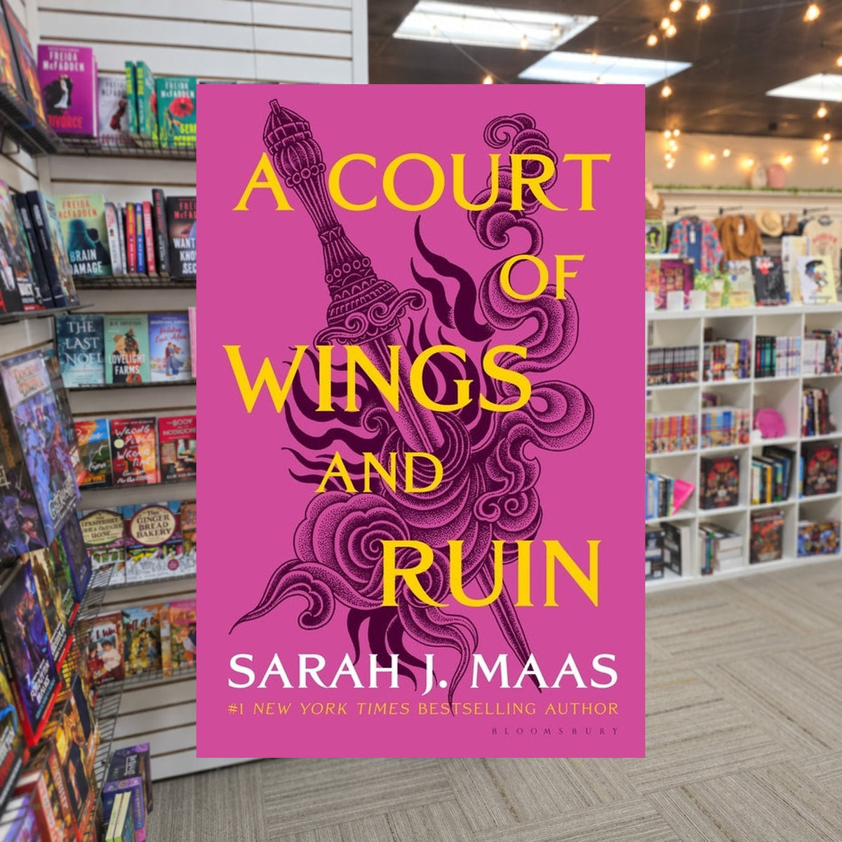 A Court of Wings and Ruin by Sarah J. Maas — actual cover on The Perk bookstore background