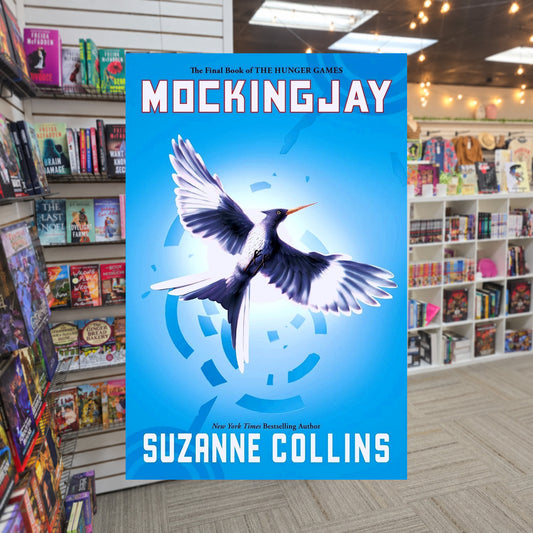 The Hunger Games #3: Mockingjay by Suzanne Collins — actual cover on The Perk bookstore background