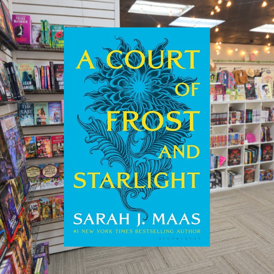 A Court of Frost and Starlight by Sarah J. Maas — actual cover on The Perk bookstore background