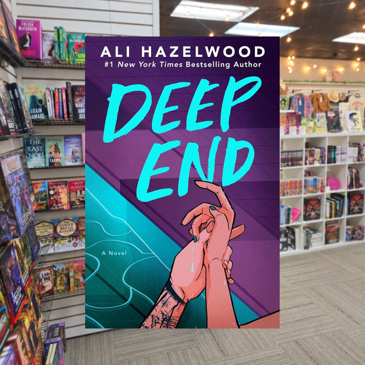 Deep End by Ali Hazelwood — actual cover on The Perk bookstore background