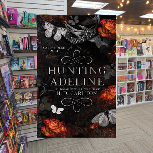 Hunting Adeline by H.D. Carlton — actual cover on The Perk bookstore background