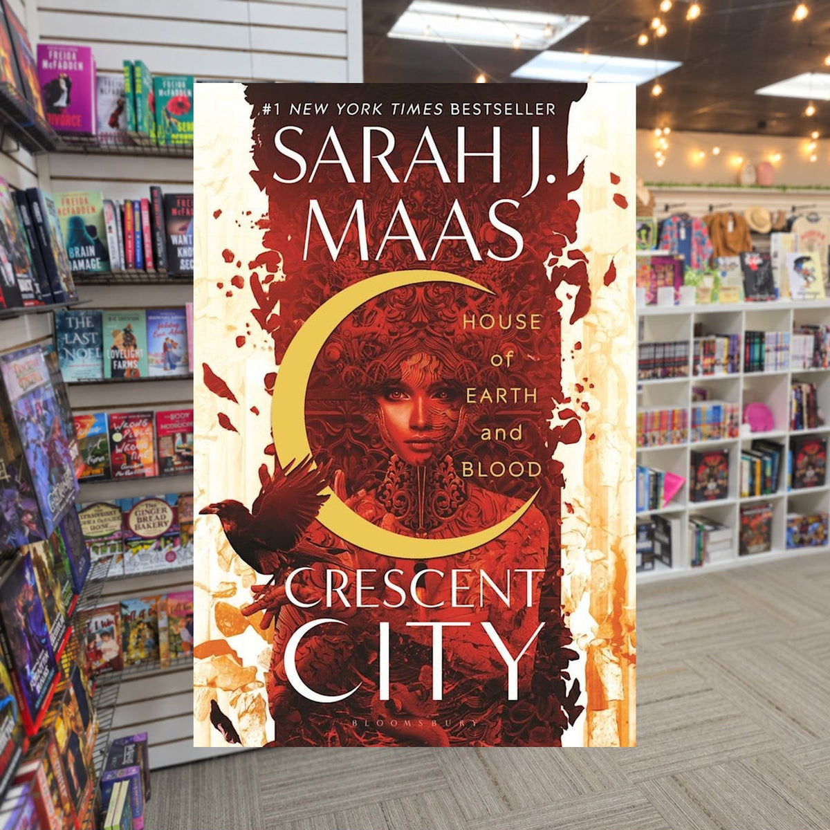 House of Earth and Blood — actual cover on The Perk bookstore background