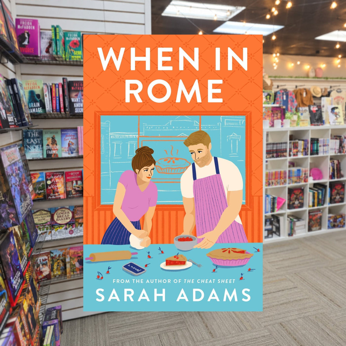 When in Rome by Sarah Adams — actual cover on The Perk bookstore background
