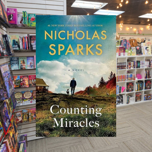 Counting Miracles by Nicholas Sparks — actual cover on The Perk bookstore background