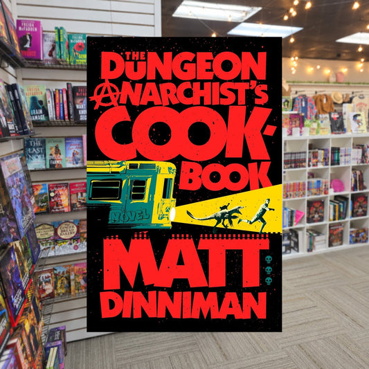 The Dungeon Anarchist's Cookbook by Matt dinniman — actual cover on The Perk bookstore background