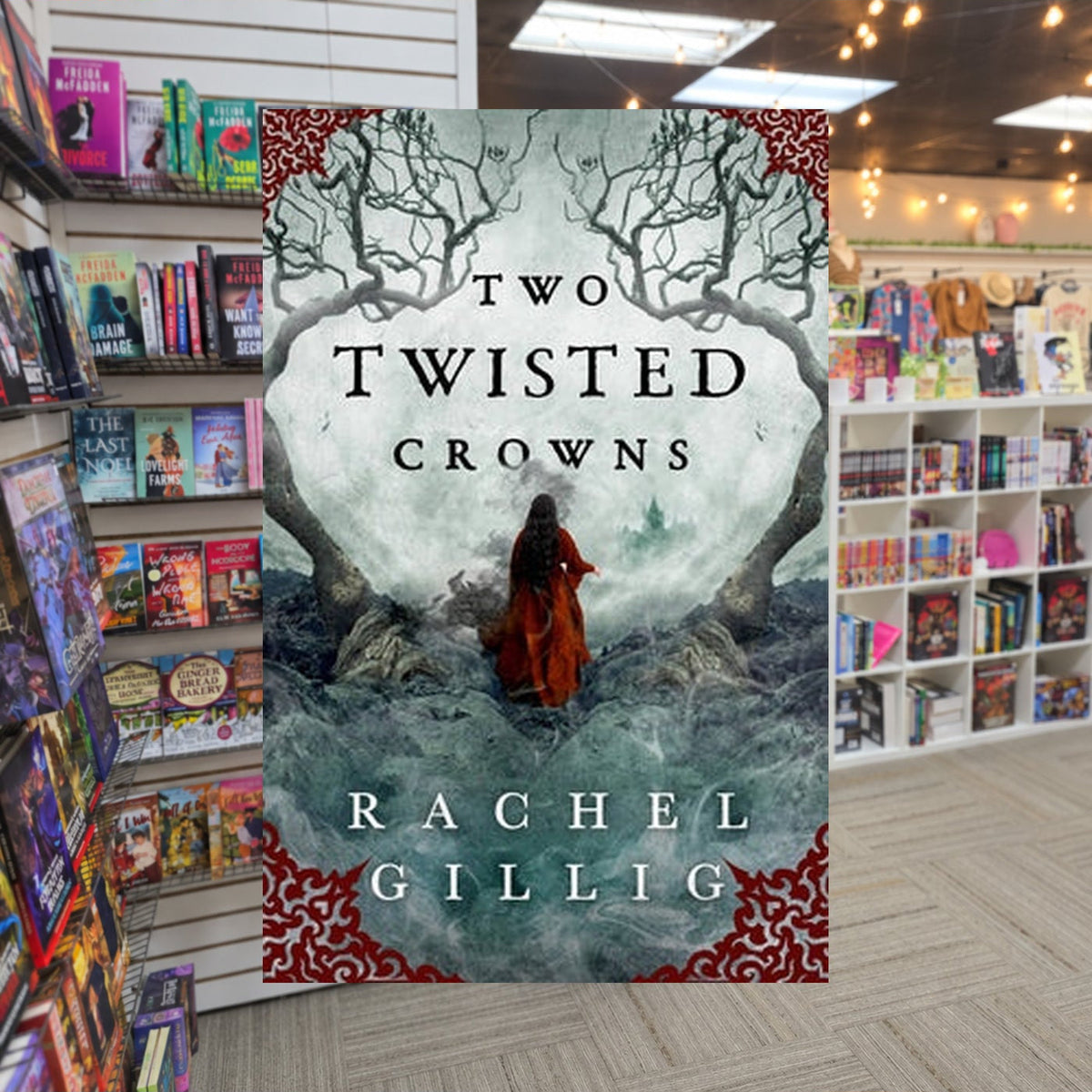 Two Twisted Crowns by Rachel Gillig — actual cover on The Perk bookstore background