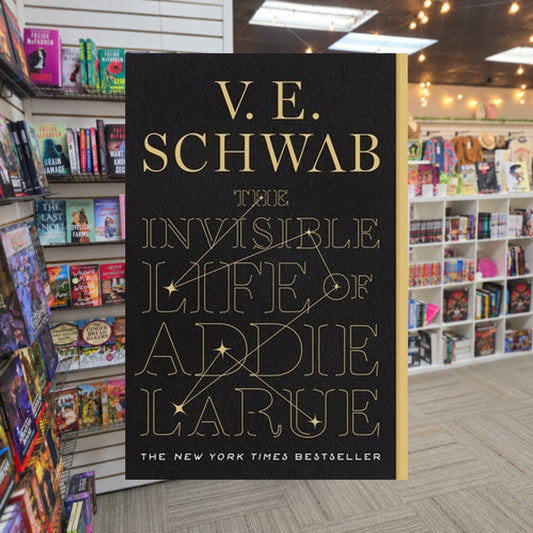 The Invisible Life of Addie Larue — actual cover on The Perk bookstore background