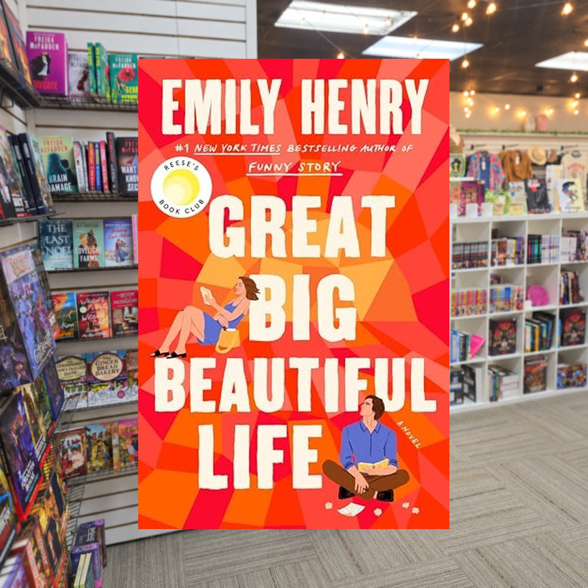Great Big Beautiful Life by Emily Henry — actual cover on The Perk bookstore background
