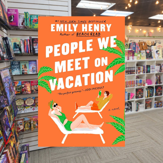 People We Meet on Vacation by Emily Henry — actual cover on The Perk bookstore background