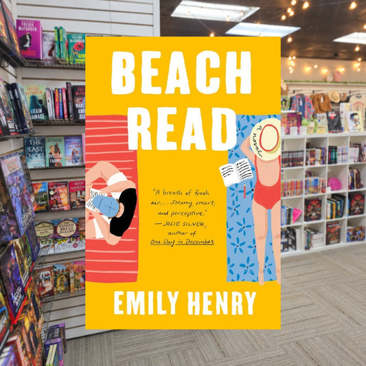 Beach Read by Emily Henry — actual cover on The Perk bookstore background