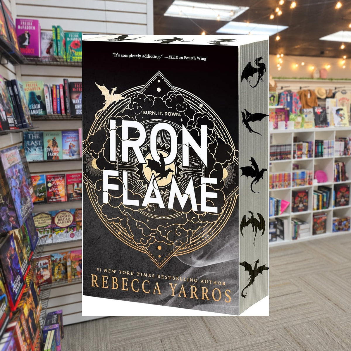 Iron Flame by Rebecca Yarros — actual cover on The Perk bookstore background
