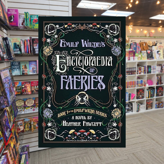 Emily Wilde's Encyclopaedia of Faeries by Heather Fawcett — actual cover on The Perk bookstore background