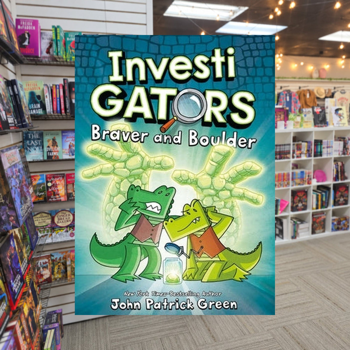 Braver and Boulder by John Patrick Green — actual cover on The Perk bookstore background