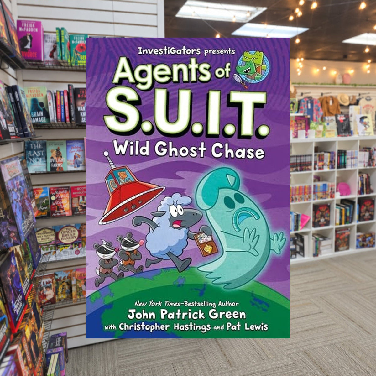 Wild Ghost Chase by John Patrick Green,  Christopher Hastings — actual cover on The Perk bookstore background