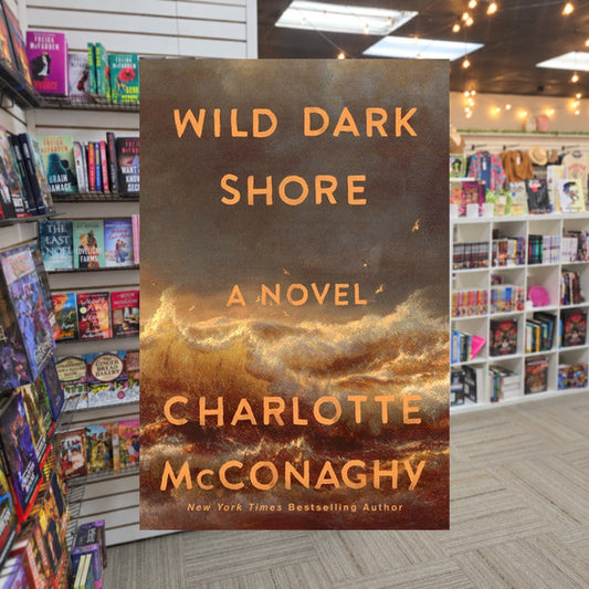 Wild Dark Shore by Charlotte McConaughy — actual cover on The Perk bookstore background
